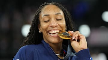Aug 11, 2024; Paris, France; United States forward A'Ja Wilson (9) celebrates with the gold medal after defeating France in the women's gold medal game during the Paris 2024 Olympic Summer Games at Accor Arena. Mandatory Credit: Kyle Terada-Imagn Images