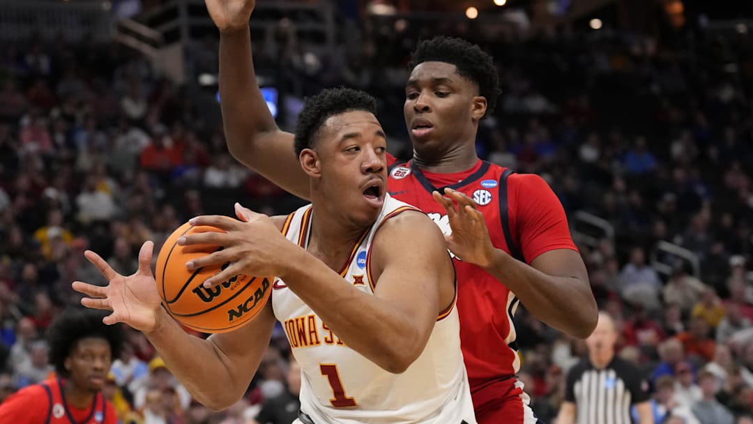 Mar 23, 2025; Milwaukee, WI, USA;  Iowa State Cyclones center Dishon Jackson (1) controls the ball against Mississippi Rebels forward Malik Dia (0) during the second half in the second round of the NCAA Tournament at Fiserv Forum. Mandatory Credit: Jeff Hanisch-Imagn Images
