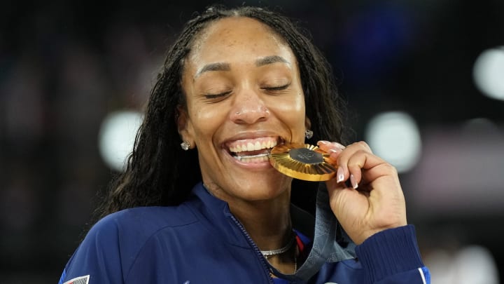 South Carolina Gamecocks legend A'ja Wilson posing with her latest Olympic gold medal