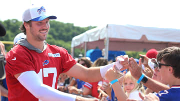 Bills quarterbacks Josh Allen runs around the entire practice field high-fiving and fist-bumping fans at the end of the opening day of Buffalo Bills training camp at St. John Fisher University.