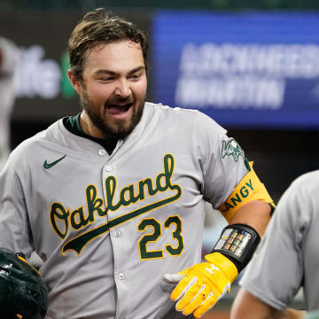 Apr 9, 2024; Arlington, Texas, USA; Oakland Athletics catcher Shea Langeliers (23) is greeted at the dugout after hitting a solo home run during the seventh inning against the Texas Rangers at Globe Life Field. Mandatory Credit: Raymond Carlin III-USA TODAY Sports