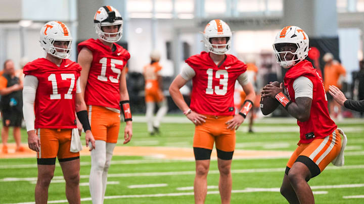 Tennessee quarterbacks, from left, Ryan Staub (17), George MacIntyre (15), Mason Phillips (13) and Faizon Brandon (11) during the Vols' first spring football practice in Knoxville on March 16, 2026.