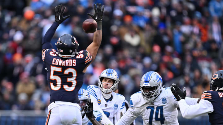 Dec 10, 2023; Chicago, Illinois, USA; Detroit Lions quarterback Jared Goff (16) throws through the defense of Chicago Bears linebacker T.J. Edwards (53) in the second half at Soldier Field. Mandatory Credit: Jamie Sabau-USA TODAY Sports