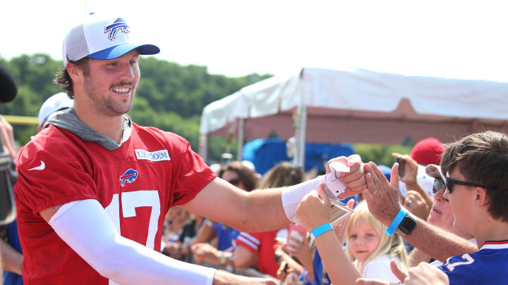 Bills quarterbacks Josh Allen runs around the entire practice field high-fiving and fist-bumping fans at the end of the opening day of Buffalo Bills training camp at St. John Fisher University.