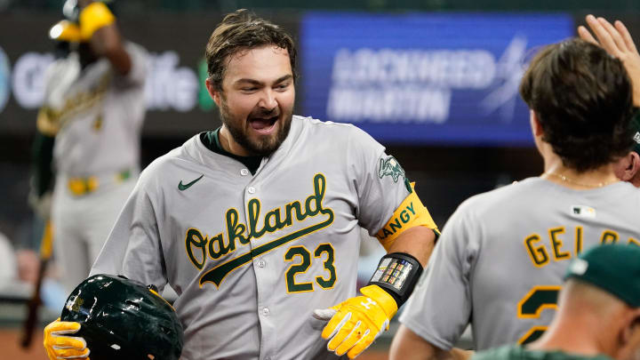 Apr 9, 2024; Arlington, Texas, USA; Oakland Athletics catcher Shea Langeliers (23) is greeted at the dugout after hitting a solo home run during the seventh inning against the Texas Rangers at Globe Life Field. Mandatory Credit: Raymond Carlin III-USA TODAY Sports