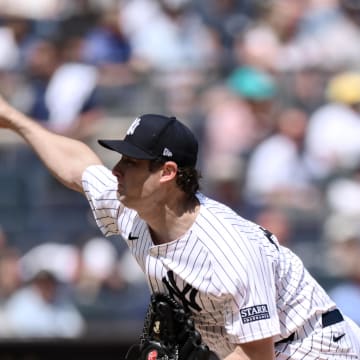 Aug 22, 2024; Bronx, New York, USA; New York Yankees pitcher Gerrit Cole (45) pitches against the Cleveland Guardians during the second inning at Yankee Stadium. 