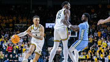 Feb 23, 2025; Wichita, Kansas, USA; Wichita State Shockers guard Xavier Bell (1) drives to the basket during the second half against the Tulane Green Wave at Charles Koch Arena.