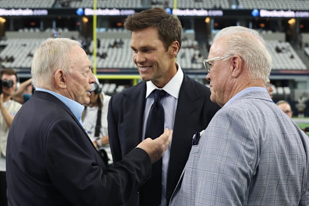 Dallas Cowboys owner Jerry Jones, Fox Sports commentator Tom Brady and Cowboys CEO Stephen Jones talk on the field