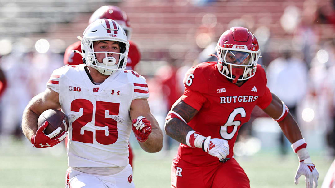 Wisconsin running back Cade Yacamelli (25) gains yards after catch as Rutgers defensive back Shaquan Loyal pursues during the second half at SHI Stadium in Piscataway, N.J., on Oct. 12, 2024. 