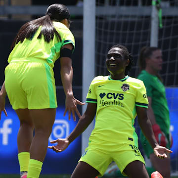 Washington Spirit forward Rosemonde Kouassi (right) scored in a 3–2 win over Chicago.