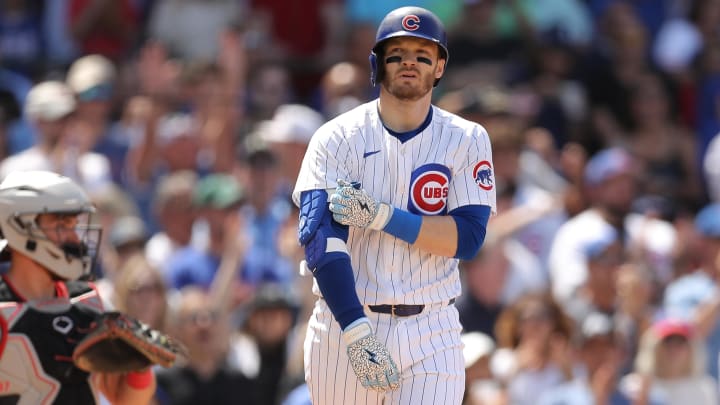 May 31, 2024; Chicago, Illinois, USA; Chicago Cubs outfielder Ian Happ (8) walks with bases loaded during the fifth inning against the Cincinnati Reds at Wrigley Field.