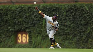 Aug 17, 2025; Chicago, Illinois, USA; Pittsburgh Pirates second baseman Ronny Simon (63) throws the ball towards home plate during eighth inning against the Chicago Cubs at Wrigley Field. Mandatory Credit: Melissa Tamez-Imagn Images