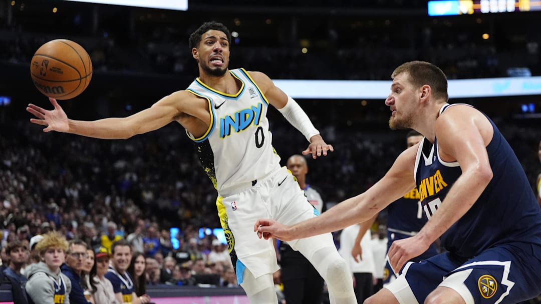 Apr 6, 2025; Denver, Colorado, USA; Indiana Pacers guard Tyrese Haliburton (0) and Denver Nuggets center Nikola Jokic (15) reach for the ball in the second half at Ball Arena. Mandatory Credit: Ron Chenoy-Imagn Images Apr 6, 2025; Denver, Colorado, USA; Indiana Pacers guard Tyrese Haliburton (0) and Denver Nuggets center Nikola Jokic (15) reach for the ball in the second half at Ball Arena. Mandatory Credit: Ron Chenoy-Imagn Images