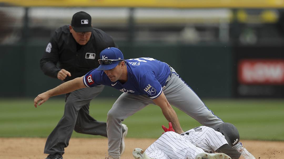 Apr 17, 2024; Chicago, Illinois, USA; Kansas City Royals second base Adam Frazier (26) tags Chicago White Sox outfielder Andrew Benintendi (23) out at second base after trying to steal during the fourth inning during game one of a double header at Guaranteed Rate Field. Mandatory Credit: Melissa Tamez-USA TODAY Sports
