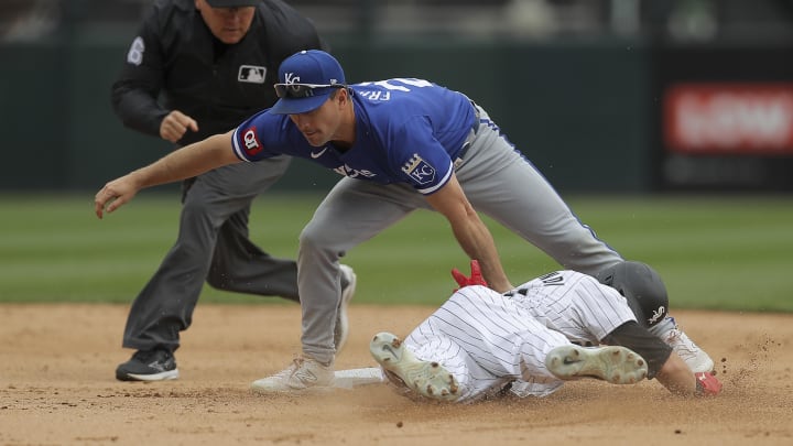 Apr 17, 2024; Chicago, Illinois, USA; Kansas City Royals second base Adam Frazier (26) tags Chicago White Sox outfielder Andrew Benintendi (23) out at second base after trying to steal during the fourth inning during game one of a double header at Guaranteed Rate Field. Mandatory Credit: Melissa Tamez-USA TODAY Sports