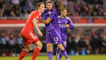 May 3, 2025; Chicago, Illinois, USA; Chicago Fire FC defender Jack Elliot (3) and Orlando City forward Duncan McGuire (13) battle for position during the first half at Soldier Field. Mandatory Credit: Melissa Tamez-Imagn Images