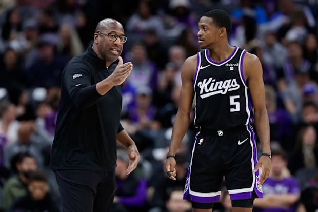 Sacramento Kings head coach Mike Brown speaks with the Hearon Fox goalkeeper (5)