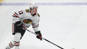 Apr 8, 2025; Pittsburgh, Pennsylvania, USA;  Chicago Blackhawks center Oliver Moore (11) skates with the puck against the Pittsburgh Penguins during the second period at PPG Paints Arena. Mandatory Credit: Charles LeClaire-Imagn Images