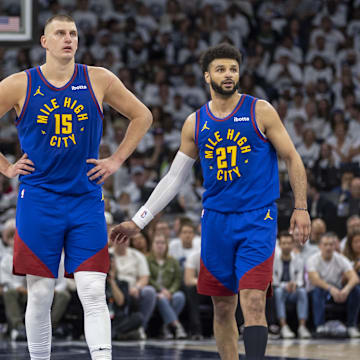 Denver Nuggets center Nikola Jokic (15) and Denver Nuggets guard Jamal Murray (27) against the Minnesota Timberwolves in 2024 NBA playoffs at Target Center. 