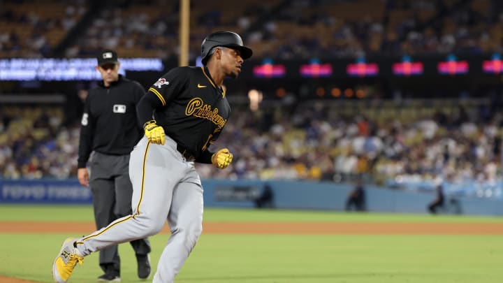 Aug 10, 2024; Los Angeles, California, USA;  Pittsburgh Pirates third baseman Ke'Bryan Hayes (13) runs around bases after hitting a home run during the ninth inning against the Los Angeles Dodgers at Dodger Stadium. Mandatory Credit: Kiyoshi Mio-USA TODAY Sports