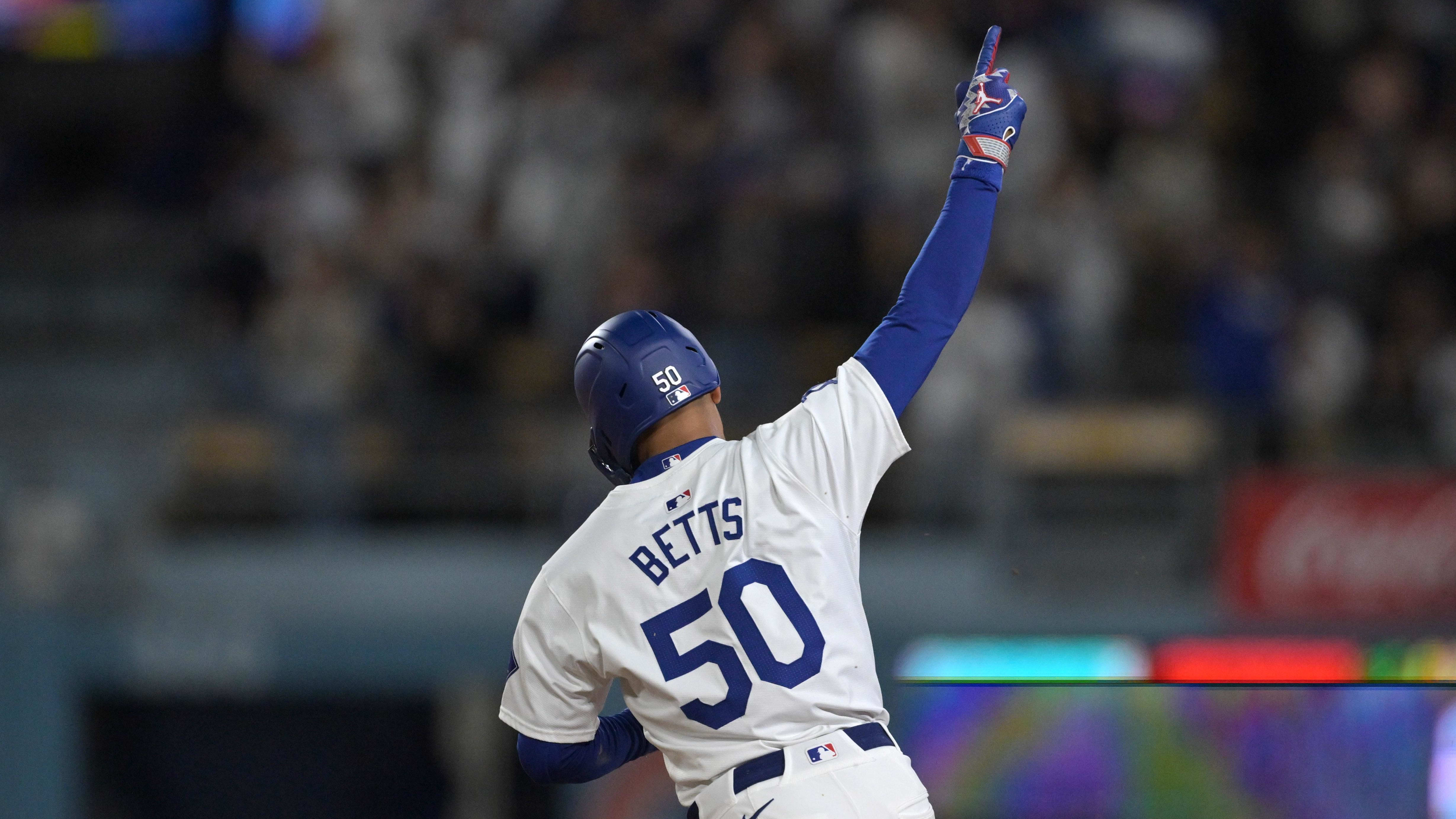 Apr 2, 2024; Los Angeles, California, USA; Los Angeles Dodgers shortstop Mookie Betts (50) rounds the bases after a home run.