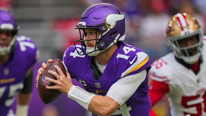 Sep 15, 2024; Minneapolis, Minnesota, USA; Minnesota Vikings quarterback Sam Darnold (14) scrambles against the San Francisco 49ers in the first quarter at U.S. Bank Stadium.