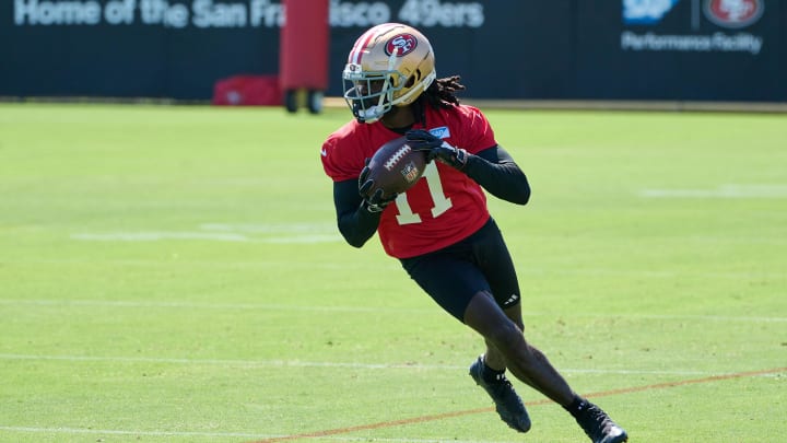 Jul 27, 2023; Santa Clara, CA, USA; San Francisco 49ers wide receiver Brandon Aiyuk (11) runs with the ball after a catch during training camp at the SAP Performance Facility. Mandatory Credit: Robert Edwards-USA TODAY Sports