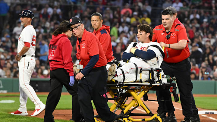 Boston Red Sox first baseman Triston Casas gets placed on a stretcher after suffering a season-ending injury.