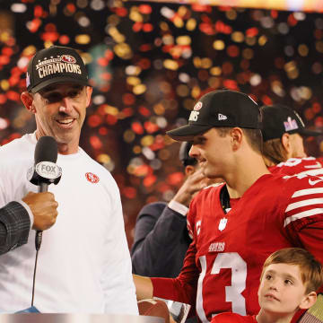 Jan 28, 2024; Santa Clara, California, USA; Fox Sports broadcaster and former NFL player Michael Strahan interviews San Francisco 49ers head coach Kyle Shanahan after winning the NFC Championship football game against the Detroit Lions at Levi's Stadium. Mandatory Credit: Kelley L Cox-USA TODAY Sports