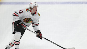 Apr 8, 2025; Pittsburgh, Pennsylvania, USA;  Chicago Blackhawks center Oliver Moore (11) skates with the puck against the Pittsburgh Penguins during the second period at PPG Paints Arena. Mandatory Credit: Charles LeClaire-Imagn Images