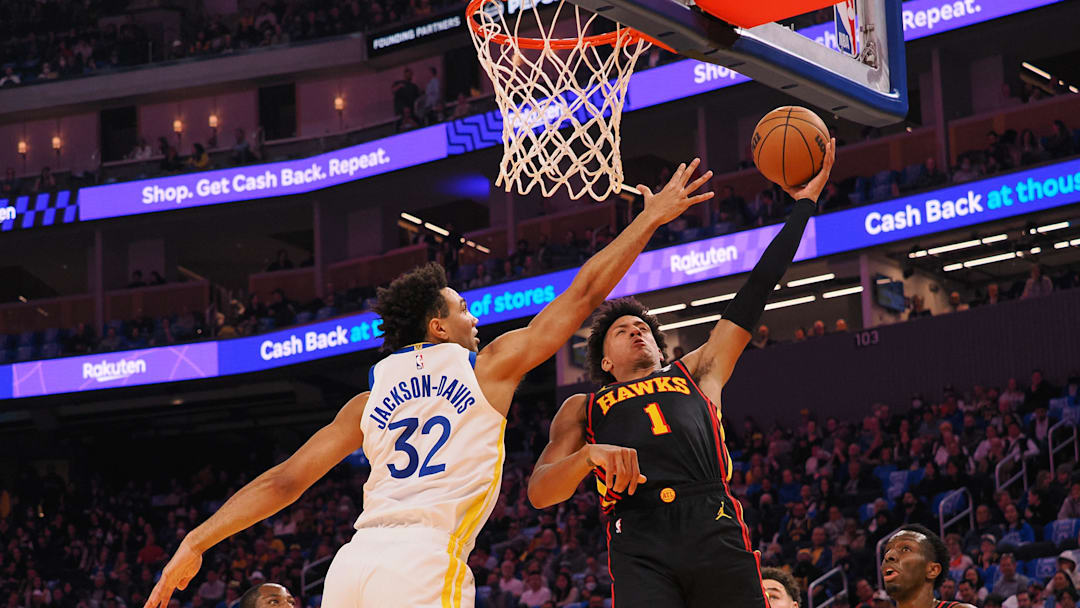 Jan 24, 2024; San Francisco, California, USA; Atlanta Hawks forward Jalen Johnson (1) goes up for a layup against Golden State Warriors forward Trayce Jackson-Davis (32) during the second quarter at Chase Center. Mandatory Credit: Kelley L Cox-Imagn Images