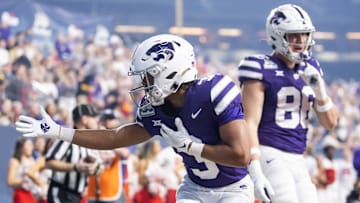 Dec 26, 2024; Phoenix, AZ, USA; Kansas State Wildcats running back Dylan Edwards (3) celebrates a touchdown against the Rutgers Scarlet Knights during the Rate Bowl at Chase Field. Mandatory Credit: Mark J. Rebilas-Imagn Images