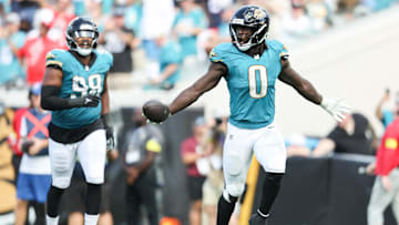 Sep 21, 2025; Jacksonville, Florida, USA; Jacksonville Jaguars linebacker Devin Lloyd (0) celebrates after intercepting the ball during the fourth quarter against the Houston Texans at EverBank Stadium. Mandatory Credit: Morgan Tencza-Imagn Images