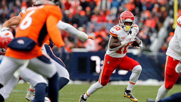 Oct 29, 2023; Denver, Colorado, USA; Kansas City Chiefs running back Isiah Pacheco (10) runs the ball as Denver Broncos safety P.J. Locke (6) defends in the second quarter at Empower Field at Mile High. Mandatory Credit: Isaiah J. Downing-Imagn Images