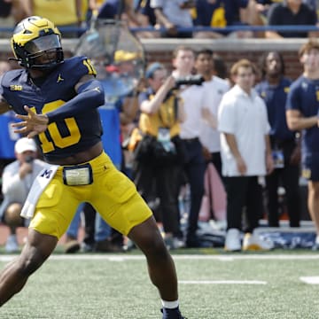 Sep 14, 2024; Ann Arbor, Michigan, USA;  Michigan Wolverines quarterback Alex Orji (10) throws against the Arkansas State Red Wolves during the second half at Michigan Stadium. Mandatory Credit: Rick Osentoski-Imagn Images