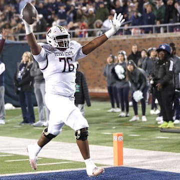 Dec 26, 2023; Dallas, TX, USA; Texas State Bobcats offensive lineman Nash Jones (76) scores a touchdown against the Rice Owls in the second half at Gerald J Ford Stadium. Mandatory Credit: Tim Heitman-Imagn Images