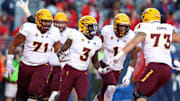 Nov 24, 2018; Tucson, AZ, USA; Arizona State Sun Devils running back Eno Benjamin (3) celebrates with teammates after scoring a touchdown against the Arizona Wildcats during the Territorial Cup at Arizona Stadium. Mandatory Credit: Mark J. Rebilas-Imagn Images
