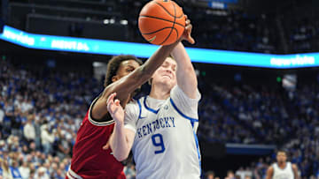 Kentucky Wildcats forward Trent Noah (9) battles Nicholls Colonels guard Zee Hamoda (24) for a loose ball in the first half at Rupp Arena in Lexington, Kentucky Nov. 4, 2025. Noah would get injured on the play and go to the bench.