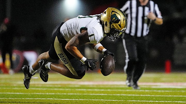 Basha safety recovers a fumble against Williams Field during a game at Williams Field High School in Gilbert, on Sept. 12, 2025. Basha safety recovers a fumble against Williams Field during a game at Williams Field High School in Gilbert, on Sept. 12, 2025.