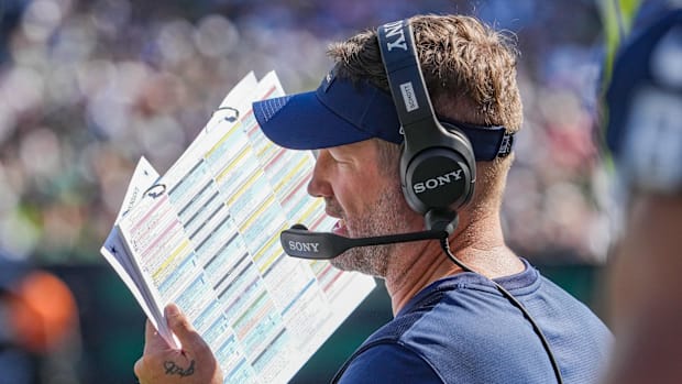 Dallas Cowboys head coach Brian Schottenheimer looks over his play sheet against the New York Jets.