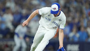 Nov 1, 2025; Toronto, Ontario, CAN; Toronto Blue Jays pitcher Chris Bassitt (40) fields a ball hit by Los Angeles Dodgers second baseman Miguel Rojas (72) in the sixth inning during game seven of the 2025 MLB World Series at Rogers Centre. Mandatory Credit: John E. Sokolowski-Imagn Images