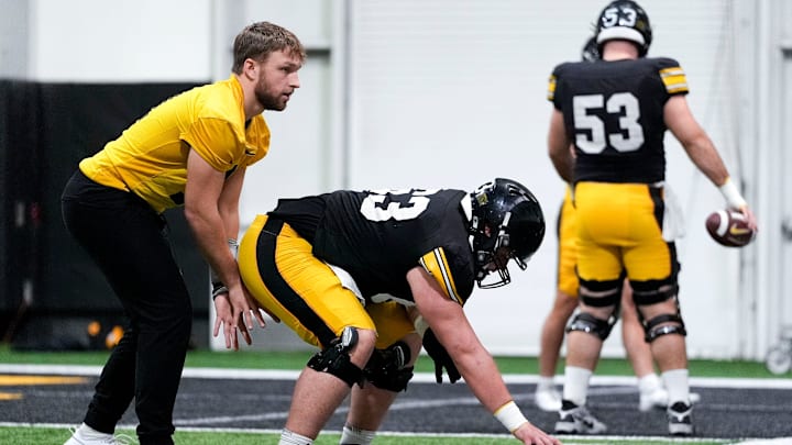 Iowa quarterback Mark Gronowski (11) lines up under center during a drill at practice Thursday, April 3, 2025 in Iowa City, Iowa.