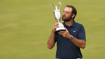  Scottie Scheffler celebrates with the Claret Jug after winning the 153rd Open Championship golf tournament at Royal Portrush. 