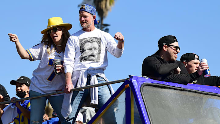 Feb 16, 2022; Los Angeles, CA, USA; Los Angeles Rams general manager Les Snead and wife Kara Henderson celebrate during the championship victory parade. Mandatory Credit: Gary A. Vasquez-Imagn Images