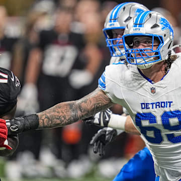 Aug 8, 2025; Atlanta, Georgia, USA; Detroit Lions guard Tate Ratledge (69) blocks Atlanta Falcons linebacker Arnold Ebiketie (17) during the second quarter at Mercedes-Benz Stadium. Mandatory Credit: Dale Zanine-Imagn Images