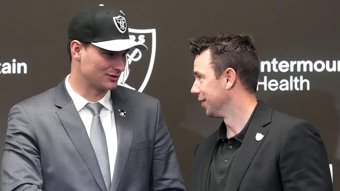 Apr 24, 2026; Henderson, NV, USA; Las Vegas Raiders quarterback Fernando Mendoza (left) shakes hands with head coach Klint Kubiak at introductory press conference at Intermountain Health Performance Center after being selected as the No. 1 pick in the 2026 NFL Draft. Mandatory Credit: Kirby Lee-Imagn Images