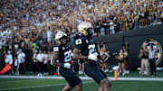 Vanderbilt running back Makhilyn Young (22) and running back AJ Newberry (23) celebrate Newberry's touchdown against Charleston Southern during their game at FirstBank Stadium in Nashville, Tenn., Saturday, Aug. 30, 2025.

The nearly perfect symmetry, mimicry of the two running backs in this image grabbed my attention immediately. We do a lot of pictures of athletes celebrating scores, but this one had a little something extra that most of my pictures don’t.