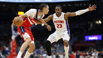 Nov 17, 2024; Washington, District of Columbia, USA; Washington Wizards forward Kyshawn George (18) dribbles the ball as Detroit Pistons guard Jaden Ivey (23) defends in the second half at Capital One Arena. Mandatory Credit: Geoff Burke-Imagn Images