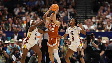 Texas Longhorns guard Ndjakalenga Mwenentanda (32) controls the ball against South Carolina Gamecocks guard Raven Johnson (25) and forward Joyce Edwards (8) during 2025 NCAA tournament, April 4, 2025 at Amalie Arena in Tampa, Florida.