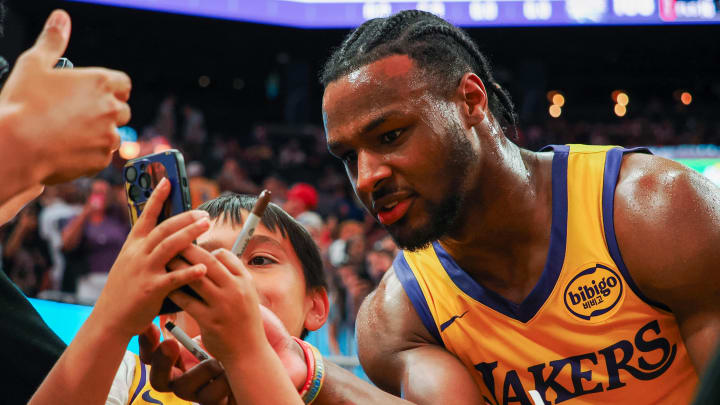 Jul 6, 2024; San Francisco, CA, USA; Los Angeles Lakers guard Bronny James Jr. (9) take s selfie with a fan after the game against the Sacramento Kings at Chase Center. Mandatory Credit: Kelley L Cox-USA TODAY Sports